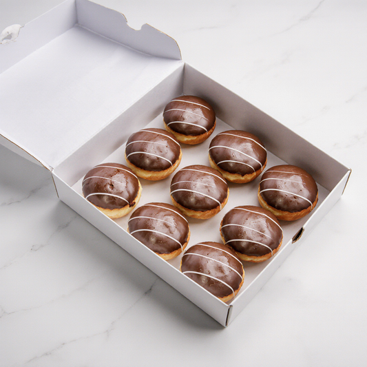 Box of Fresh Donuts from The Happy Family Bakery
with cream filling, covered in chocolate