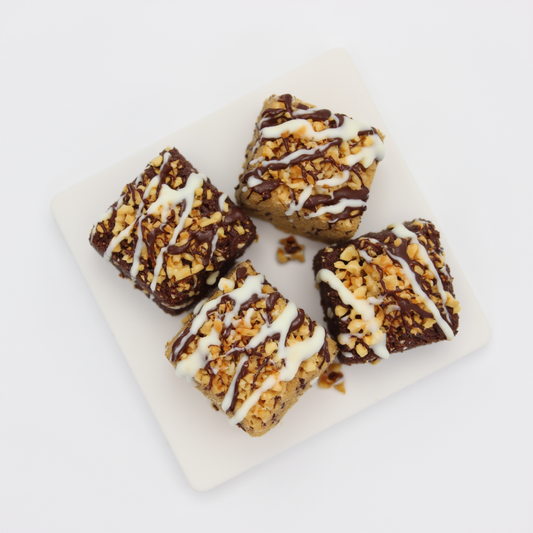Cake mix from The Happy Family Bakery made with biscuits, condensed milk, covered with nuts and drizzled with dark and white chocolate