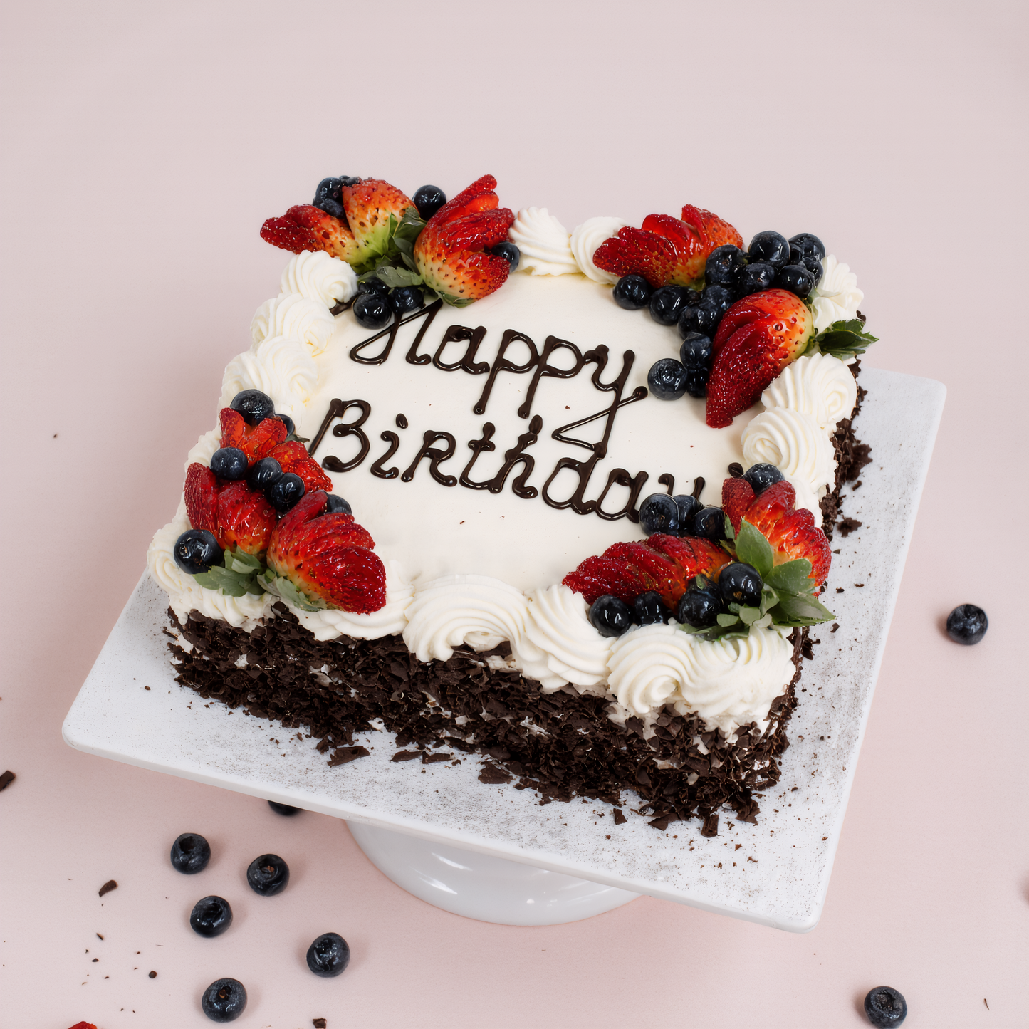 Birthday cake with berries and 'Happy Birthday' text on a pink background