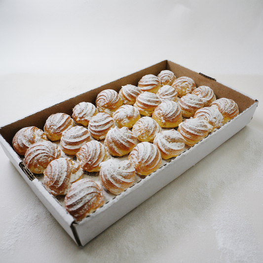 Box of Fresh profiteroles with cream from Happy Family Bakery