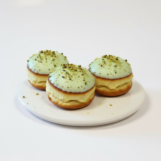 Freshly baked pistachio donuts with pistachio filling from The Happy Family Bakery